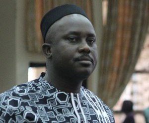 Prof. Pius Adesanmi dressed with a Baba-Awololwo-styled cap.